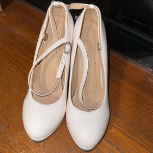 White heels with red bottoms